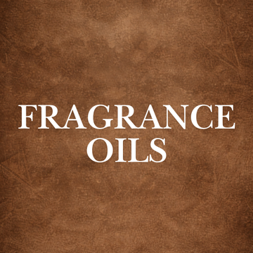 Bottle of premium Fragrance Oils surrounded by aromatic spices and flowers, emphasizing pure and alcohol-free qualities.