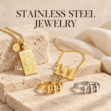 Stainless Steel Jewelry collection jewelry arranged on warm ivory stone at Ancient Infusions.