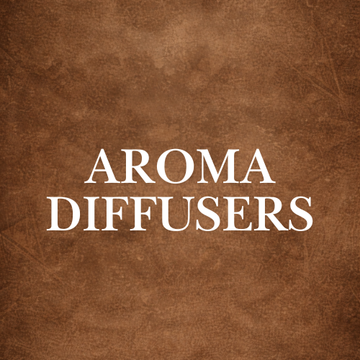 Aroma Diffusers Collection on a table in a cozy bedroom, enhancing wellness with natural scents and essential oils.