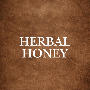 Herbal honey infused with soursop, sea moss, turmeric, and ashwagandha displayed in glass jars.