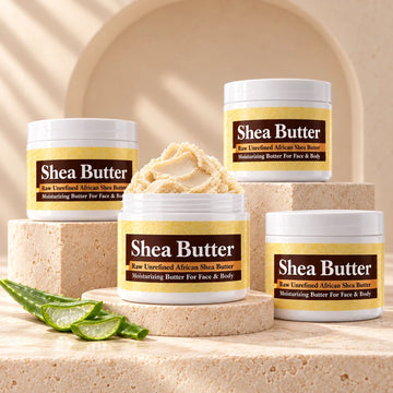 Shea butter skin care jars arranged on ivory stone
