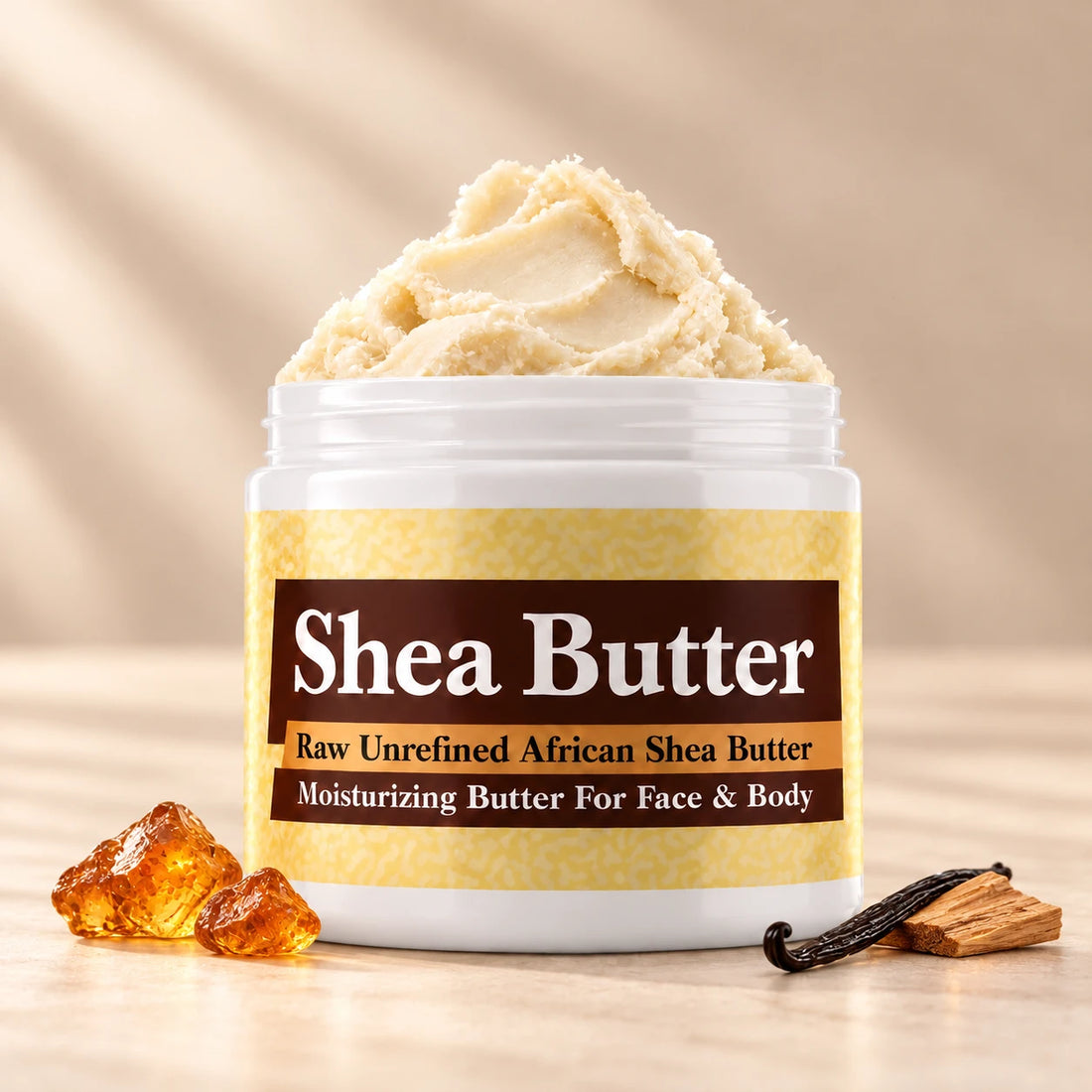 Egyptian Amber Shea Butter in an open white jar with textured ivory shea butter and simple scent accents on a soft cream background.