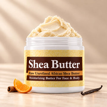 Joop Shea Butter in an open white jar with textured ivory shea butter and simple scent accents on a soft cream background.