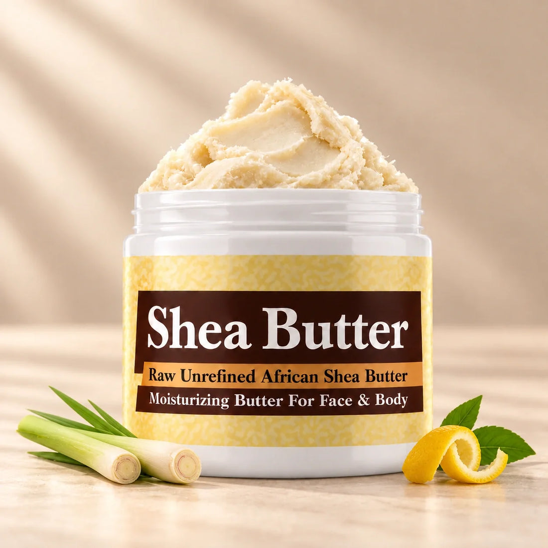 Lemongrass Shea Butter in an open white jar with textured ivory shea butter and subtle scent accents on a soft cream background.