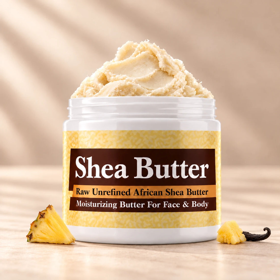 Pineapple Shea Butter in an open white jar with textured ivory shea butter and subtle scent accents on a soft cream background.