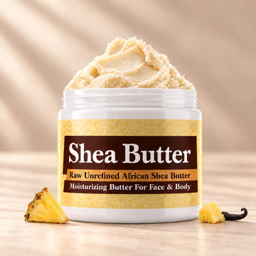 Pineapple Shea Butter in an open white jar with textured ivory shea butter and subtle scent accents on a soft cream background.