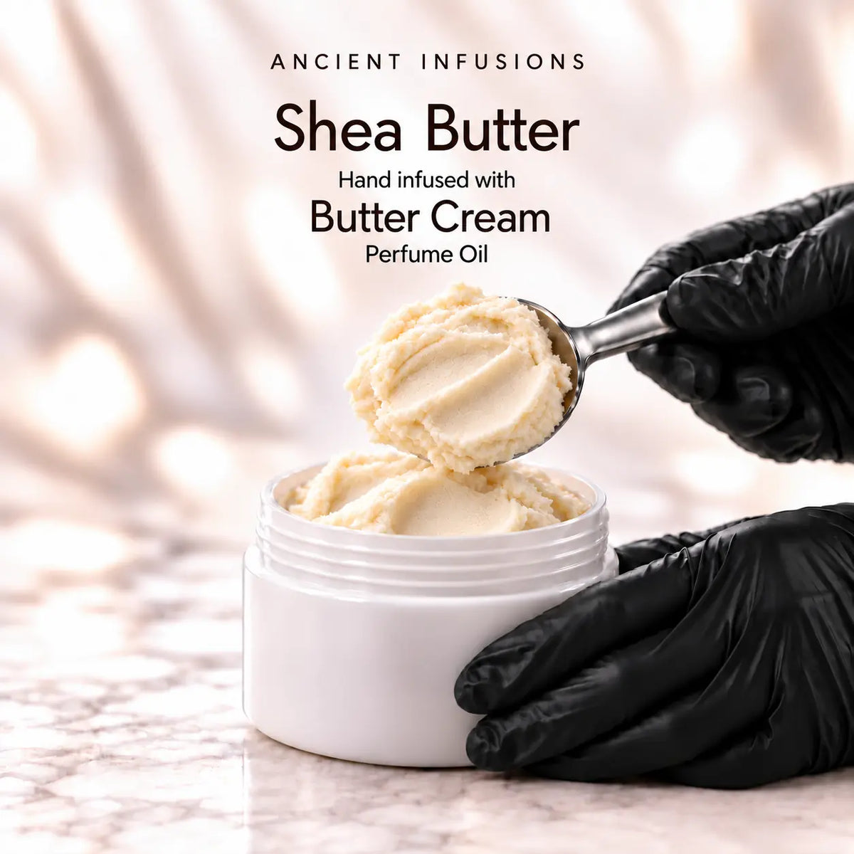 Black vinyl-gloved hands scoop shea butter hand infused with Butter Cream perfume oil.