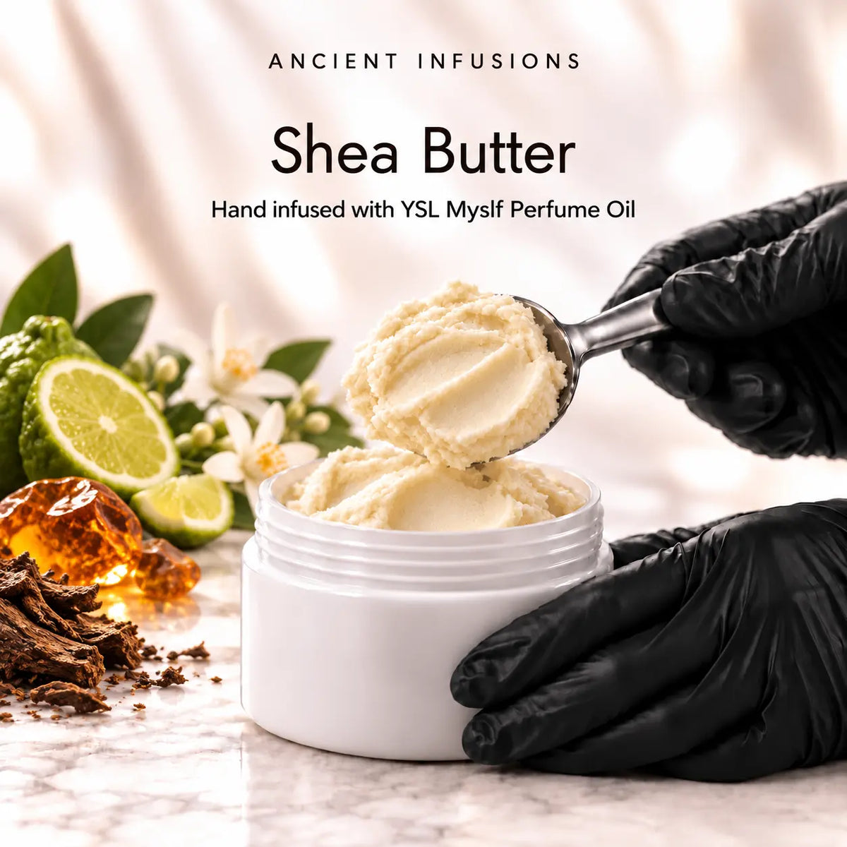 Black vinyl-gloved hands scoop raw shea butter hand infused with YSL Myslf perfume oil.