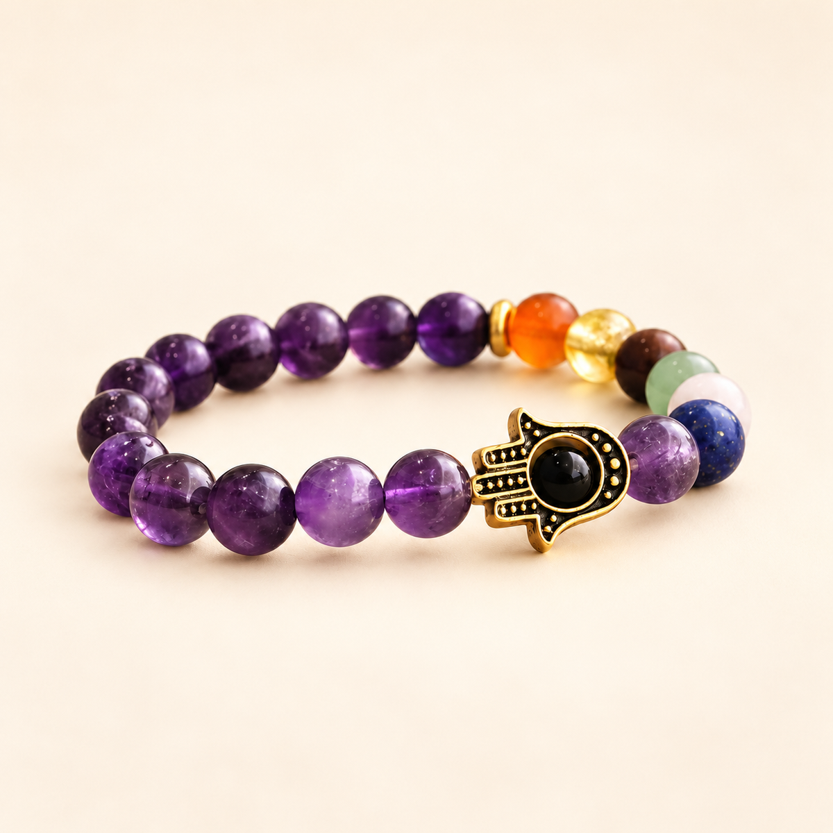 7 Chakra Amethyst Hamsa Elastic Bracelet on a soft ivory background, front view