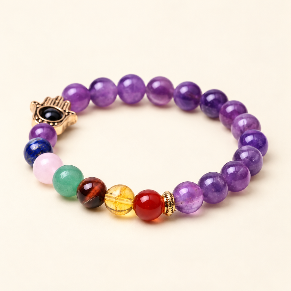 7 Chakra Amethyst Hamsa Elastic Bracelet on a soft ivory background, alternate view