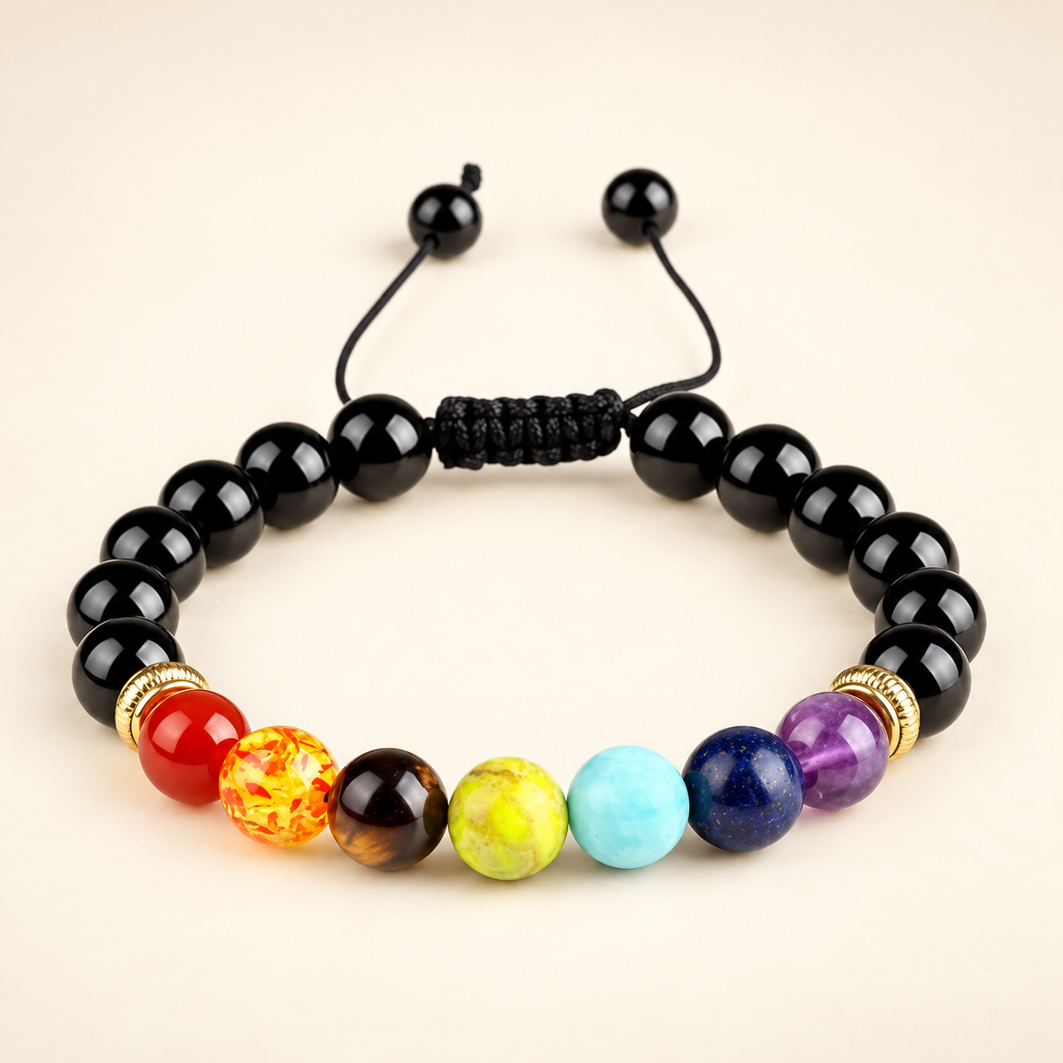 7 Chakra Black Obsidian Adjustable Bracelet on a soft ivory background