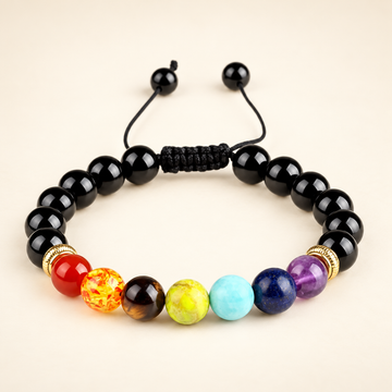 7 Chakra Black Obsidian Adjustable Bracelet on a soft ivory background