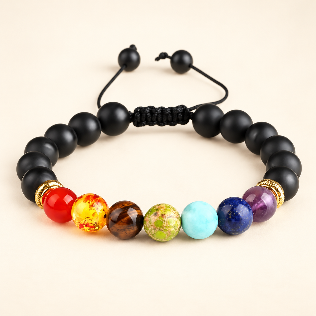 7 Chakra Black Onyx Adjustable Bracelet on a soft ivory background