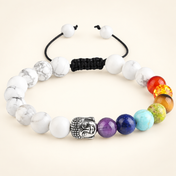 7 Chakra Howlite Buddha Adjustable Bracelet on a soft ivory background, view 1