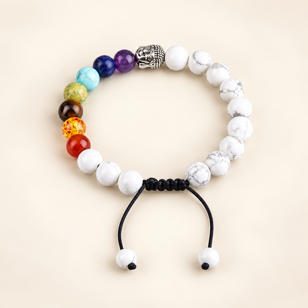 7 Chakra Howlite Buddha Adjustable Bracelet on a soft ivory background, view 2