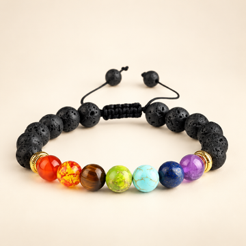 7 Chakra Lava Stone Adjustable Bracelet on a soft ivory background, view 1
