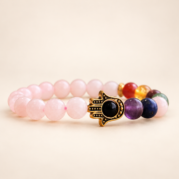 7 Chakra Rose Quartz Hamsa Elastic Bracelet on a soft ivory background, view 1