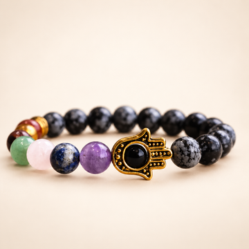 7 Chakra Snowflake Obsidian Hamsa Elastic Bracelet on a soft ivory background, view 1