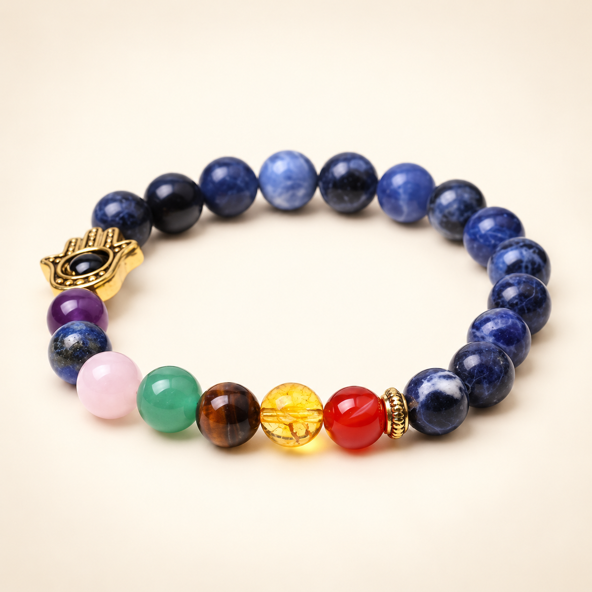 7 Chakra Sodalite Hamsa Elastic Bracelet on a soft ivory background, view 1