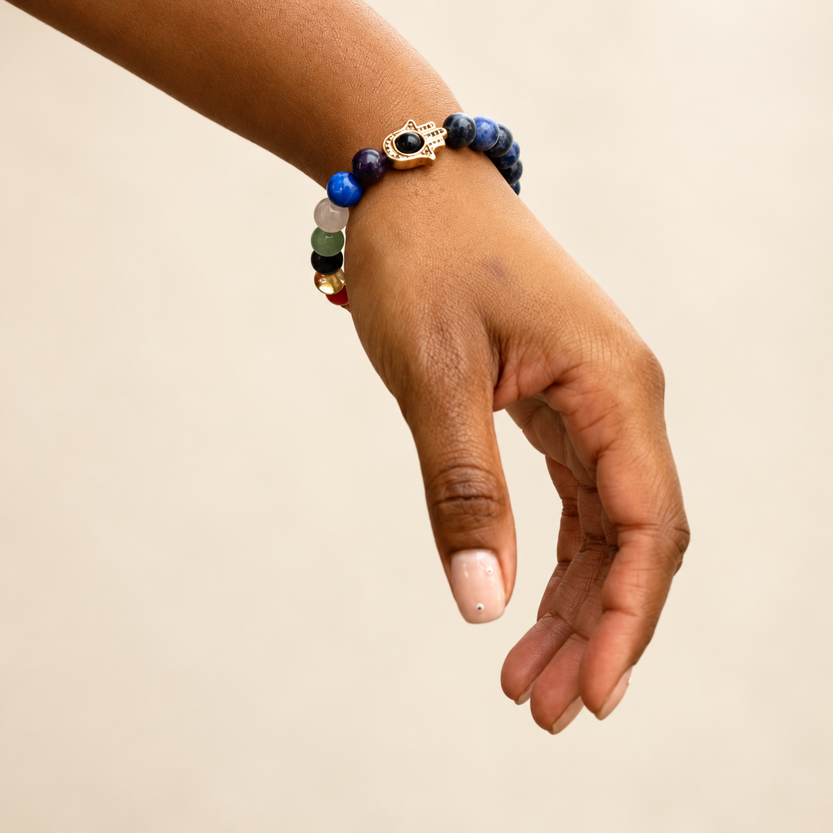 7 Chakra Sodalite Hamsa Elastic Bracelet on a soft ivory background, view 2