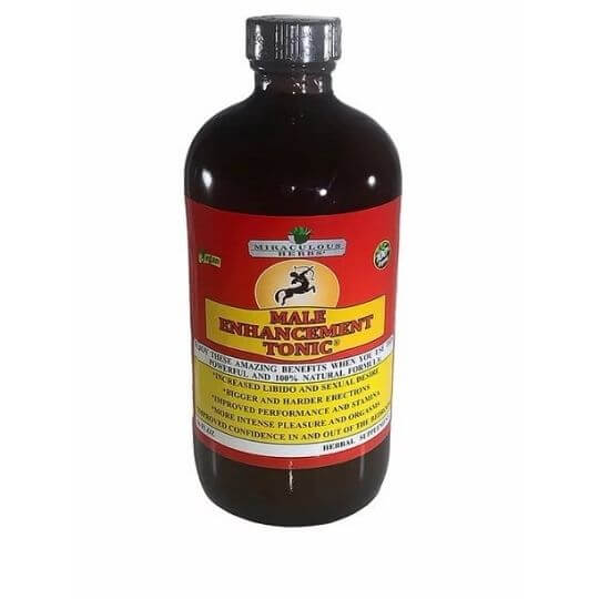 Ancient Infusions Male Enhancement bitters bottle surrounded by natural herbs like maca, ashwagandha, tongkat ali, yohimbe, black seed, and soursop on a clean natural background.