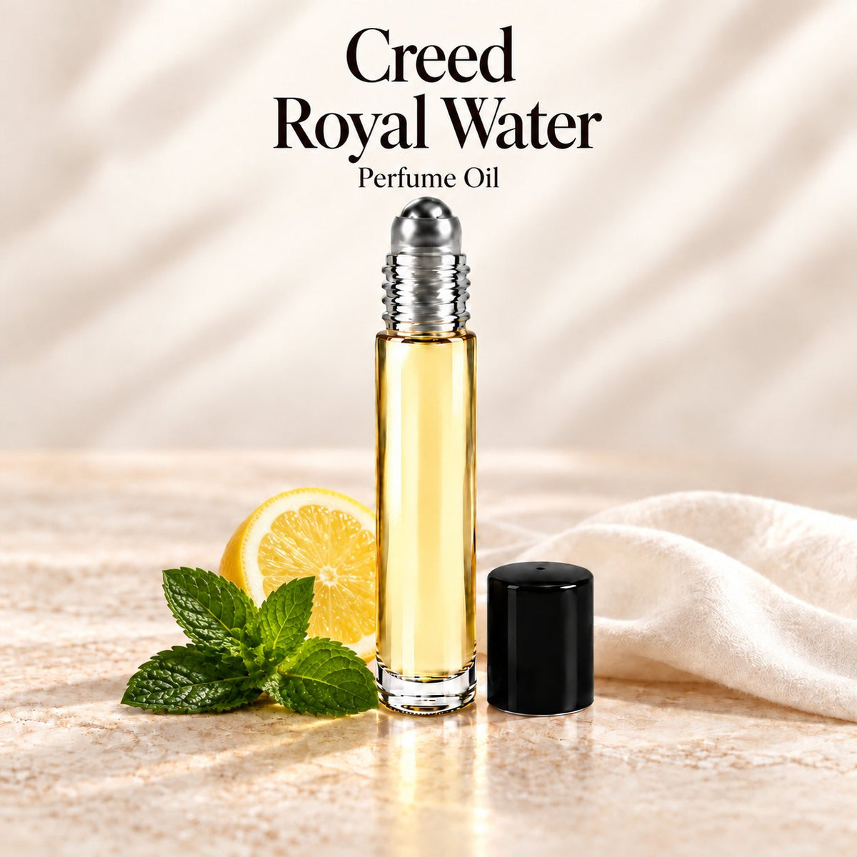 Creed Royal Water Perfume Oil in a slim glass roll-on bottle with a silver roller and black cap on an ivory stone surface.