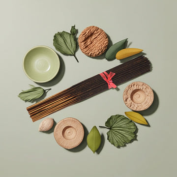 Imported Green Musk Incense Sticks with ceramic bowls and leaves on a light green background