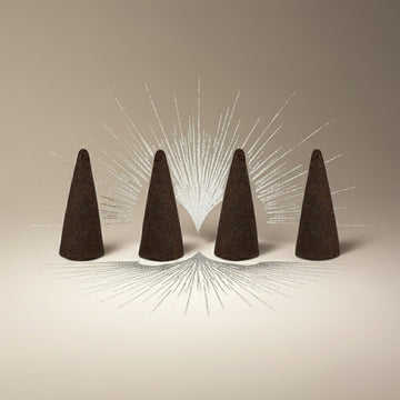 Imported Tahara Musk Incense Cones on a beige background with radiating lines.
