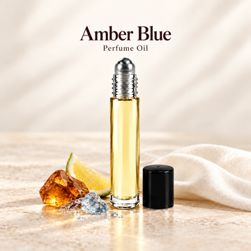 Amber Blue Perfume Oil with simple scent note accents on soft ivory