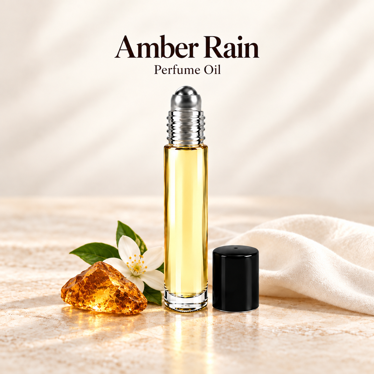 Amber Rain Perfume Oil with simple scent note accents on soft ivory