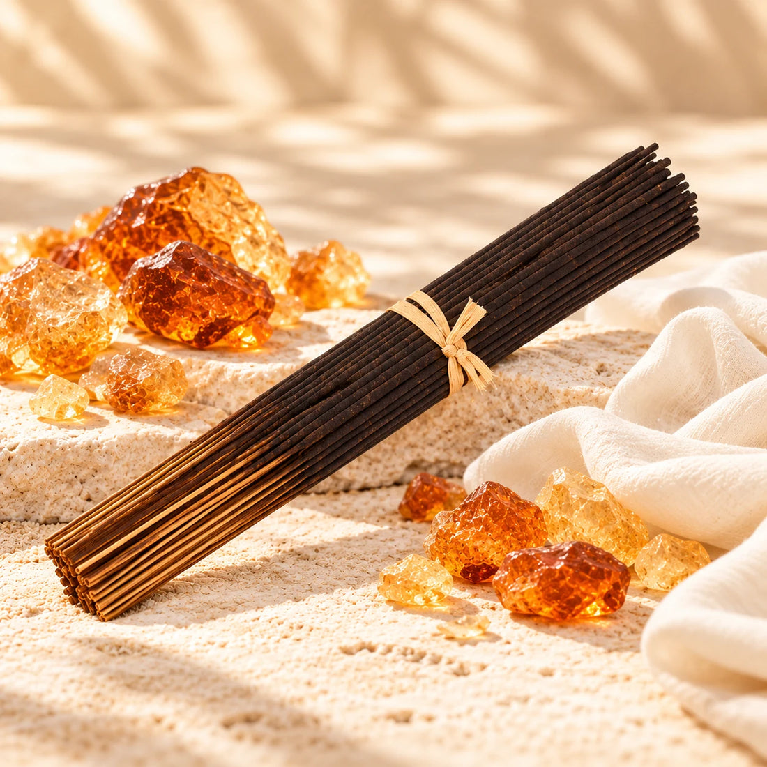 Amber White incense sticks with golden amber resin and ivory fabric.