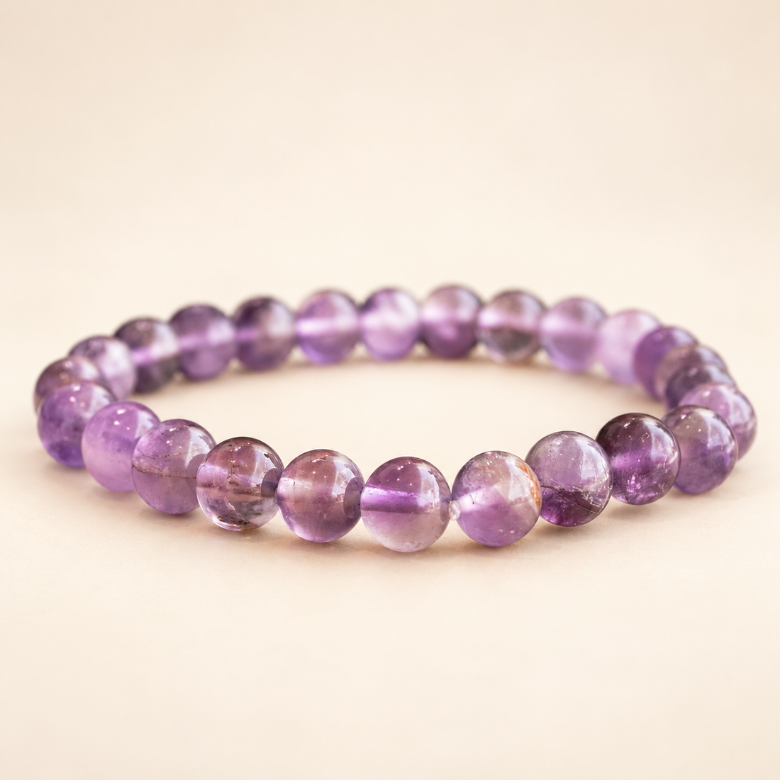 Amethyst Elastic Bracelet on a soft ivory background, view 1