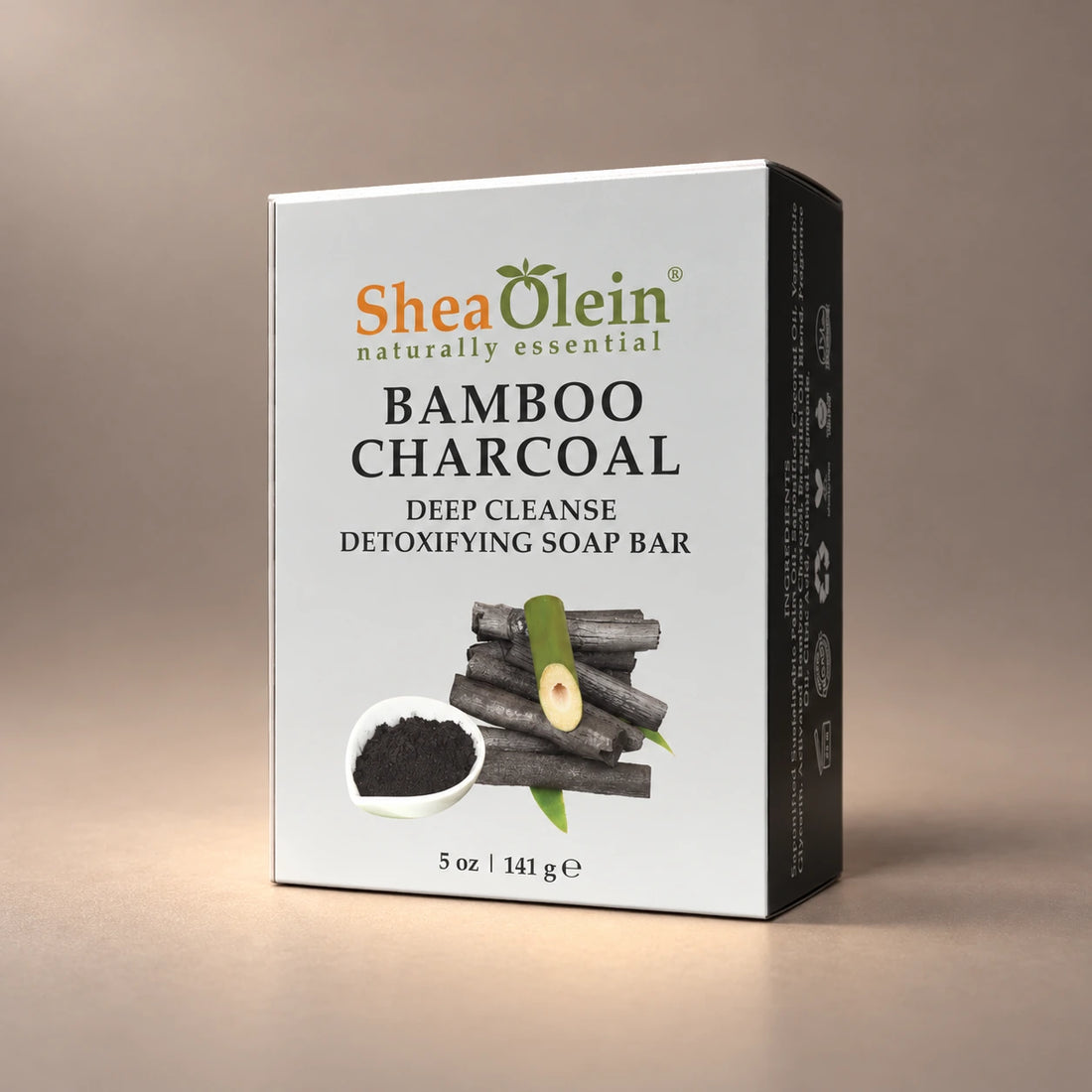 Shea Olein Bamboo Charcoal Bar Soap in its silver and black 5 oz box.