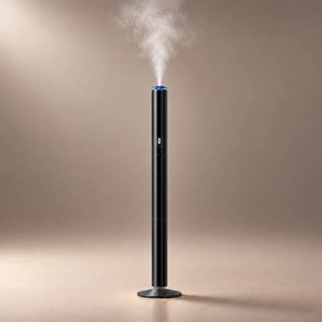 Black ASCENT floor standing waterless diffuser releasing a fine fragrance cloud.