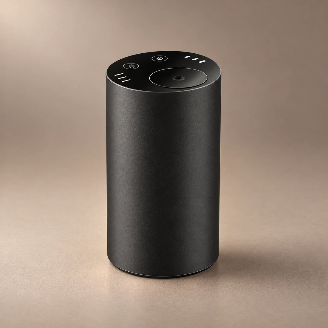 Silver DRIVE waterless car diffuser releasing fragrance from its top nozzle.