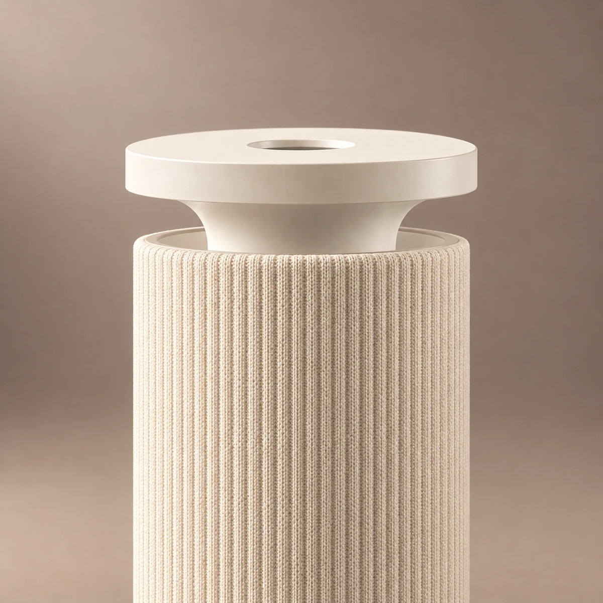 Close-up of the beige HAVEN Air Pro diffuser's top outlet, cap and vertical fabric ribs.