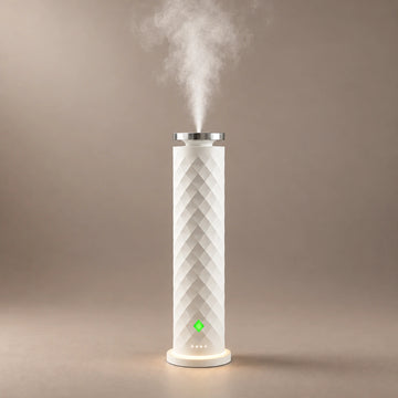 White HAVEN Air waterless diffuser with diamond faceting and a fragrance cloud rising from the top.