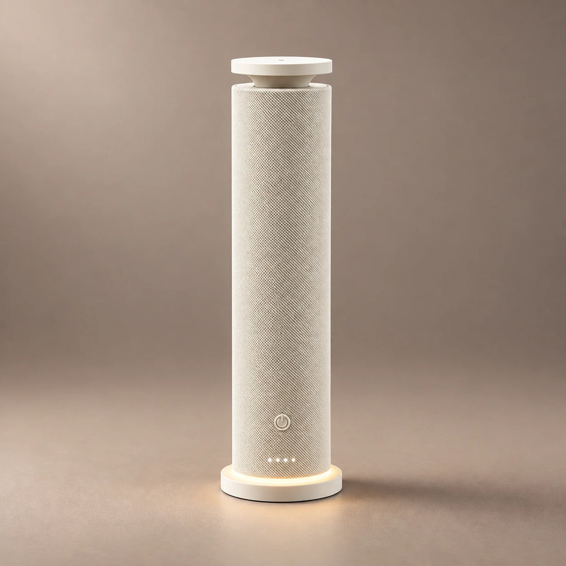 Black HAVEN waterless diffuser with a woven fabric body, warm base light and fragrance cloud.