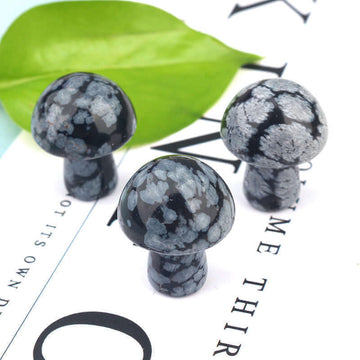 Ancient Infusions Snowflake Obsidian Carved Mushroom - Experience spiritual symmetry and delicate beauty. Front view showcasing the hand-carved perfection and protective energy of Snowflake Obsidian.