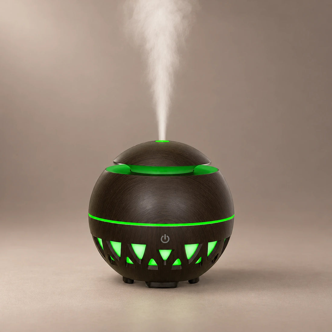 Black sphere wood grain ultrasonic diffuser with green LED light, triangular cutouts and cool mist.