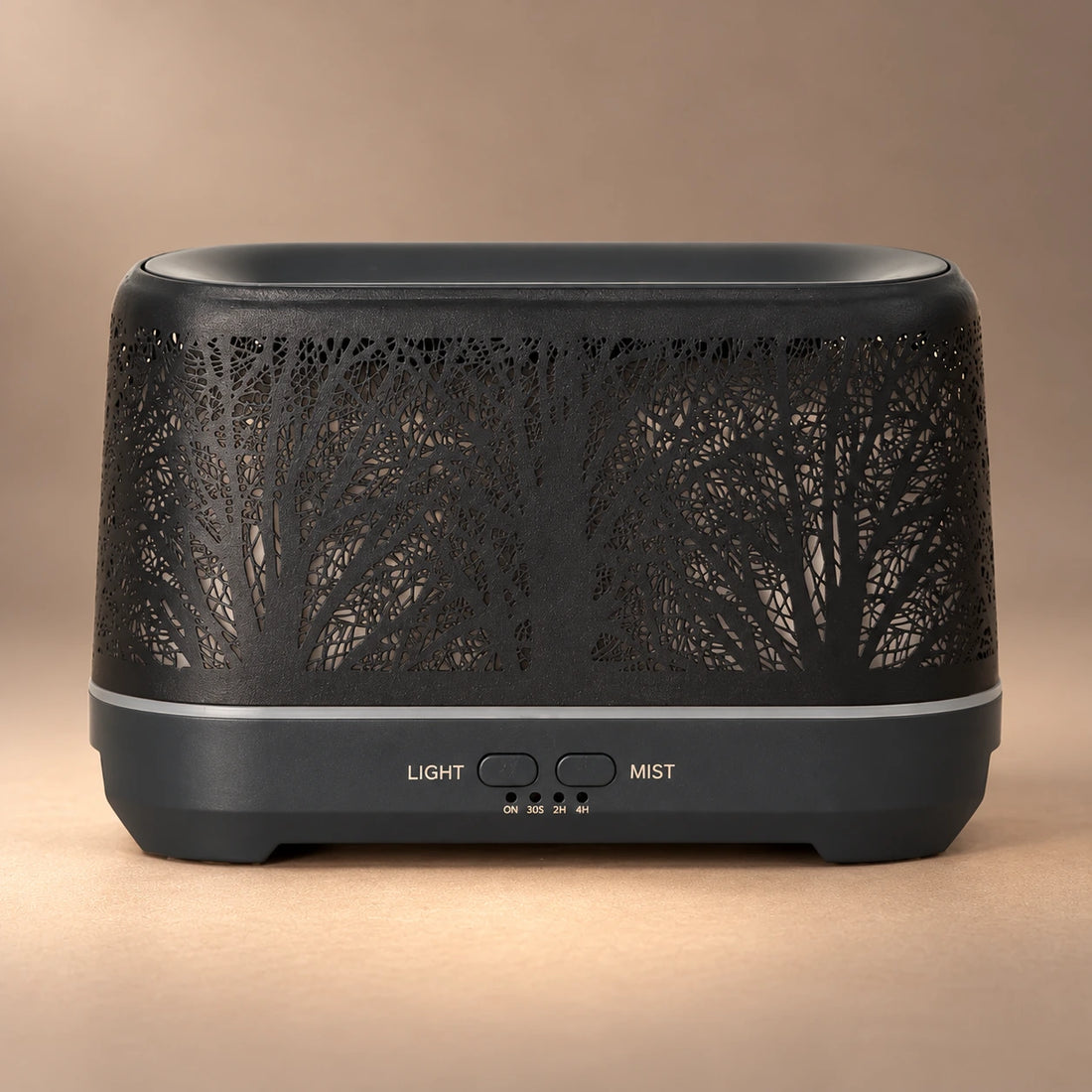 Front view of the Tree of Life diffuser with orange LED lighting and a soft illuminated mist plume.
