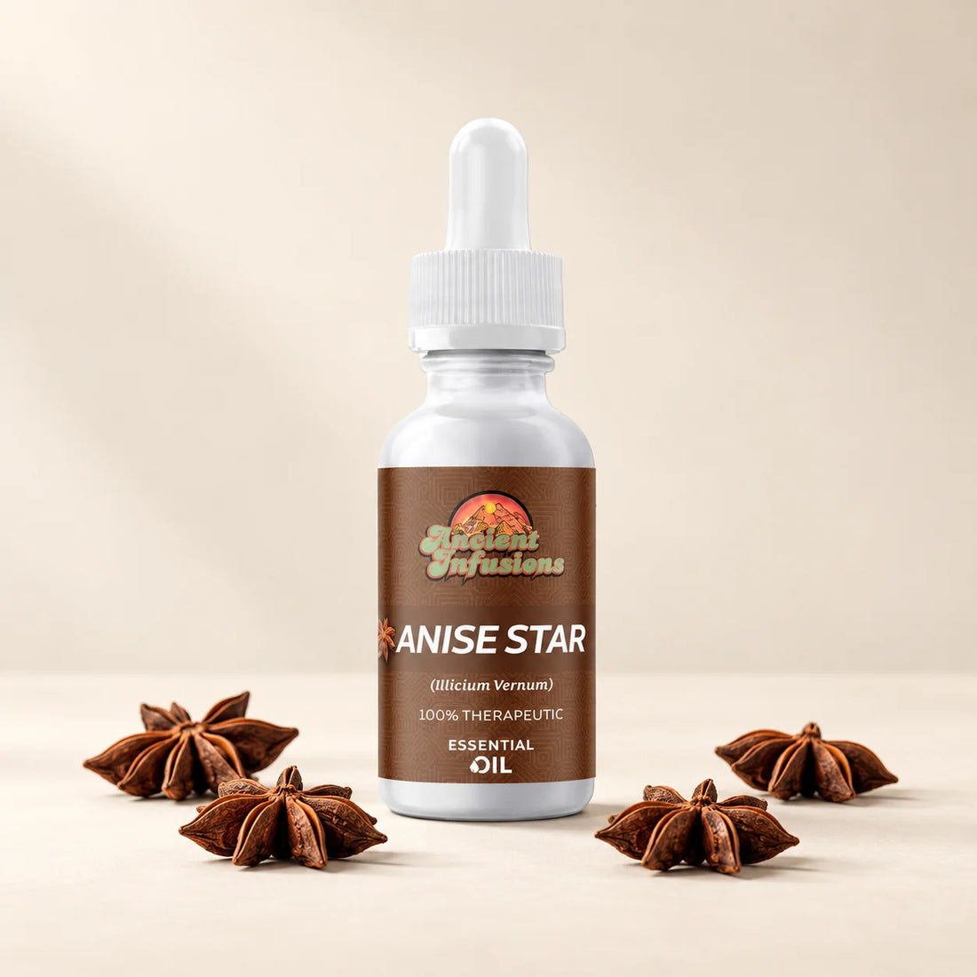 Ancient Infusions Anise Star Essential Oil bottle with dried star anise on a soft ivory background.