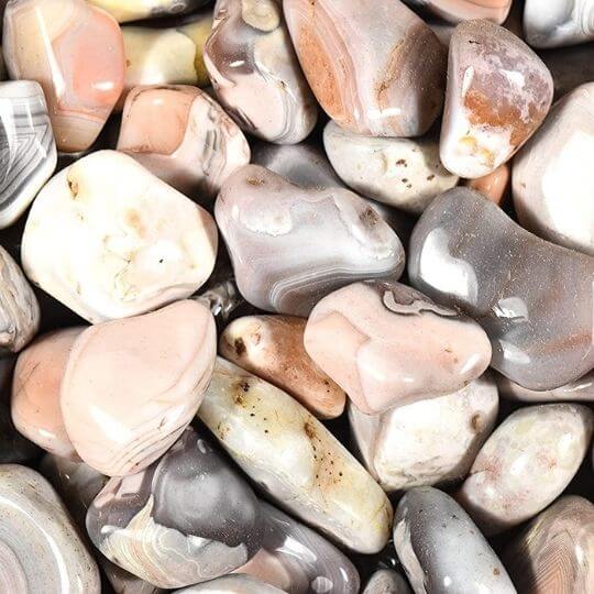 Botswana agate stones featured in the Earthbound crystal guide, emphasizing their unique energy and authenticity.