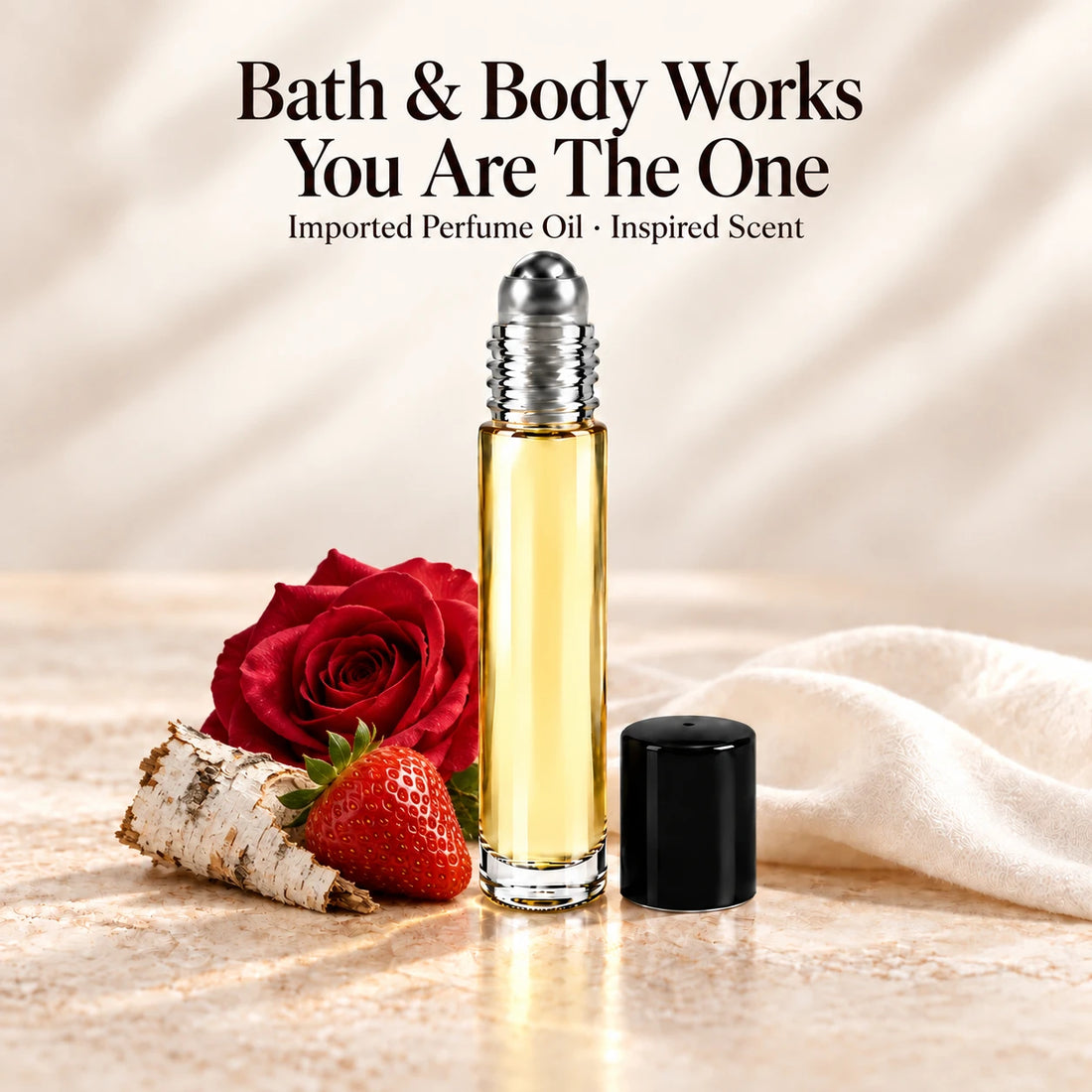 Bath & Body Works You Are The One Perfume Oil in a slim glass roll-on bottle with a silver roller and black cap on an ivory stone surface.