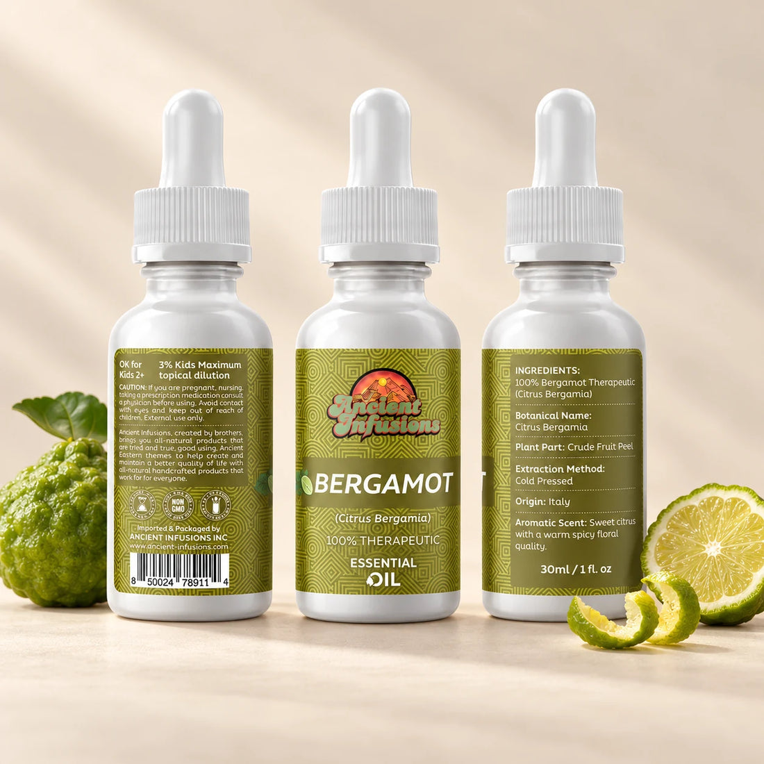 Ancient Infusions Bergamot Essential Oil bottle with botanicals on a soft ivory background.