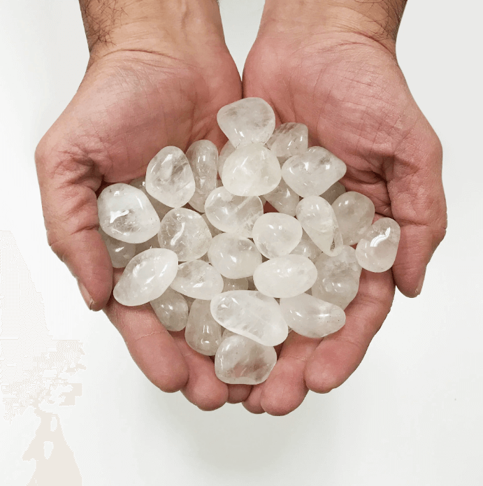 Genuine clear quartz tumbled stones showcasing their healing properties, spiritual meaning, and clarity benefits.