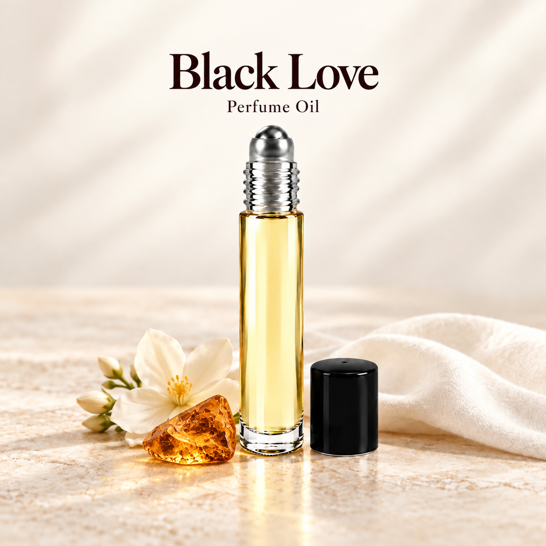 Black Love Perfume Oil with simple scent note accents on soft ivory