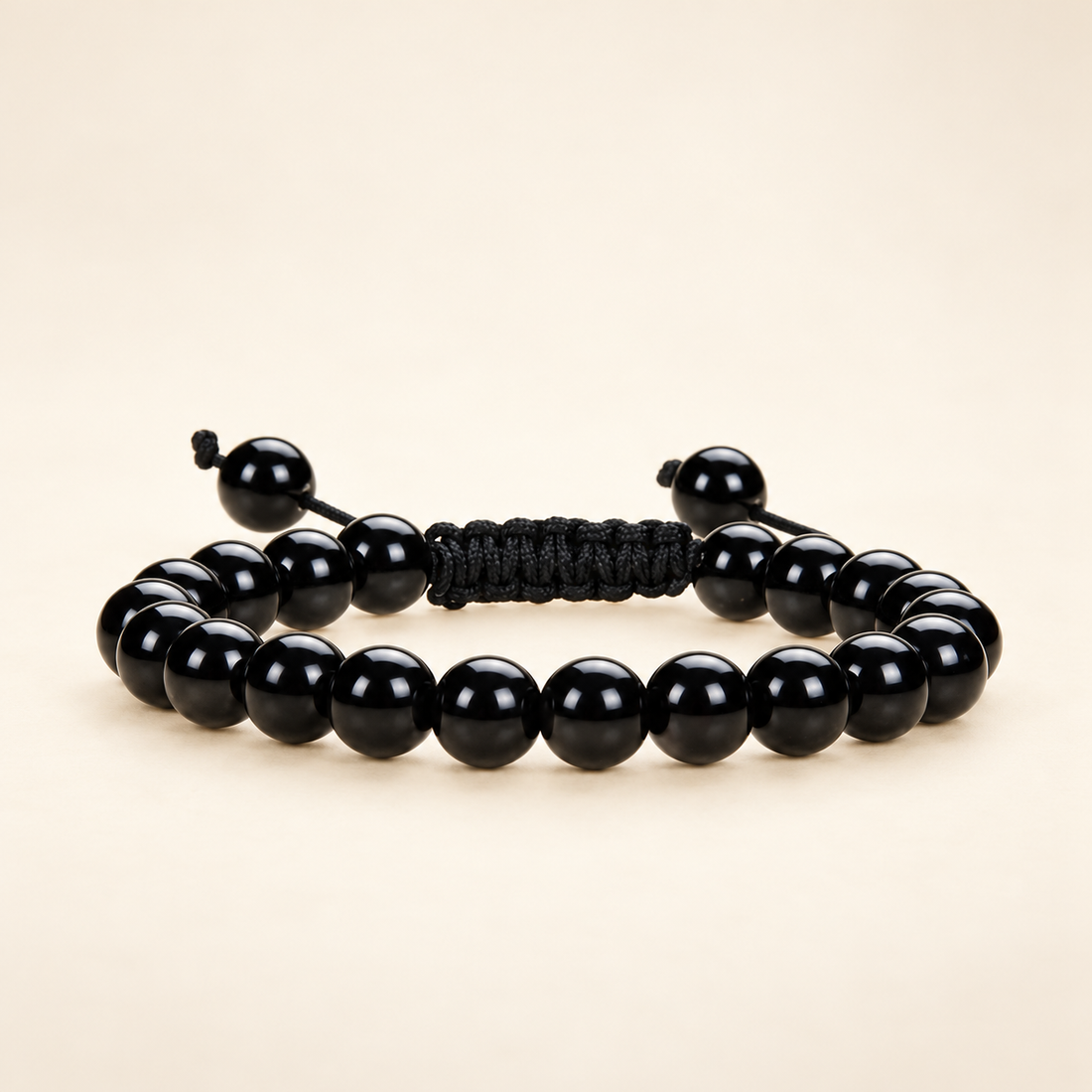 Black Obsidian Adjustable Bracelet on a soft ivory background, view 1