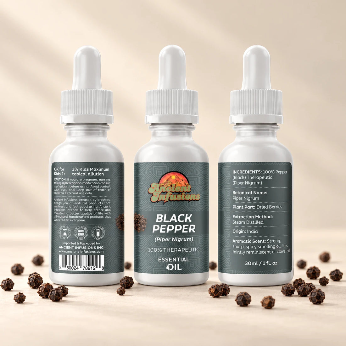 Ancient Infusions Black Pepper Essential Oil bottle with botanicals on a soft ivory background.
