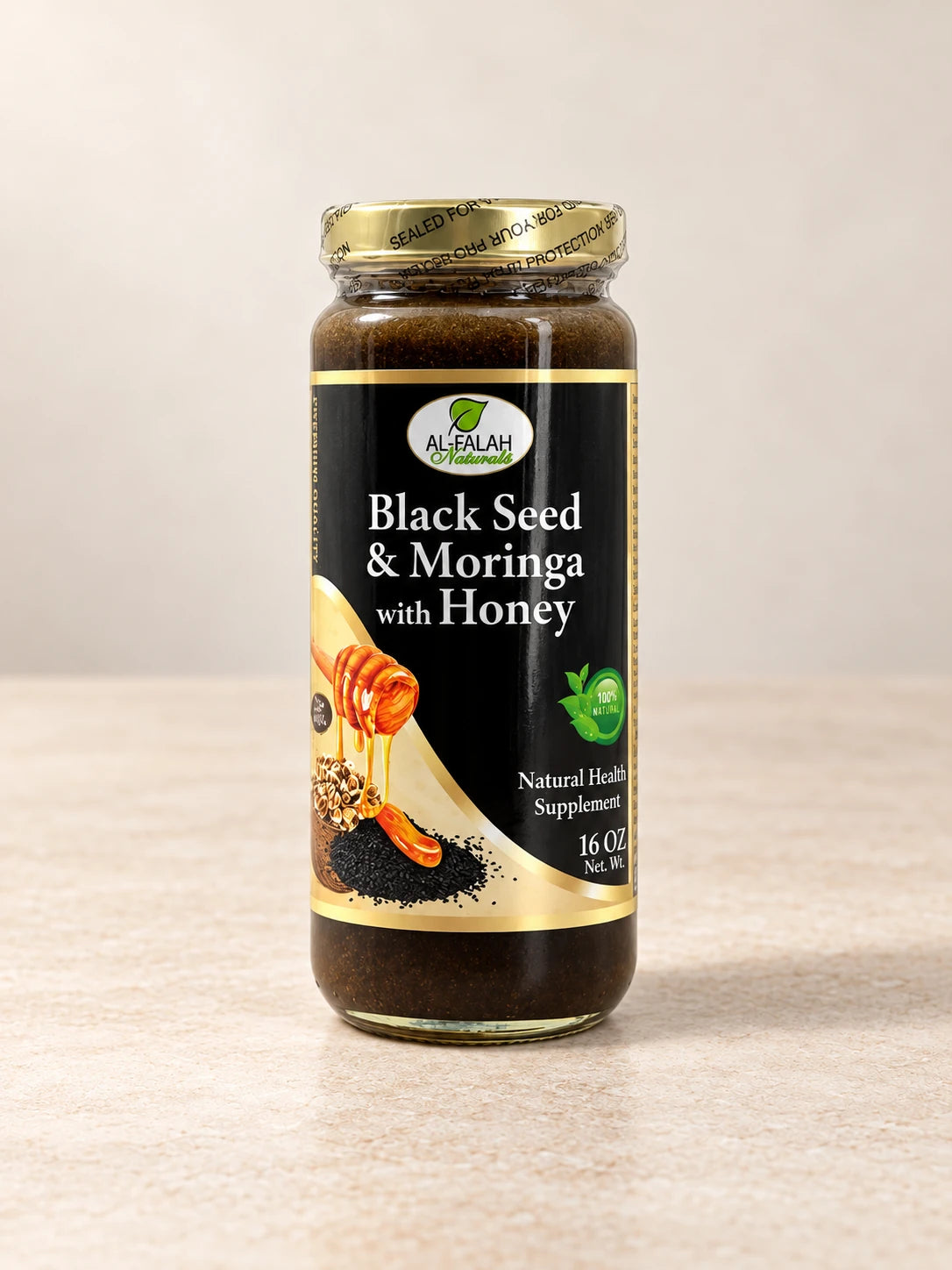 Black Seed & Moringa Honey 16 oz. product packaging on a warm ivory background